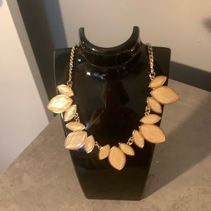 NWOT Necklace - cream colored leaf-like pattern w/gold tone chain.22” length